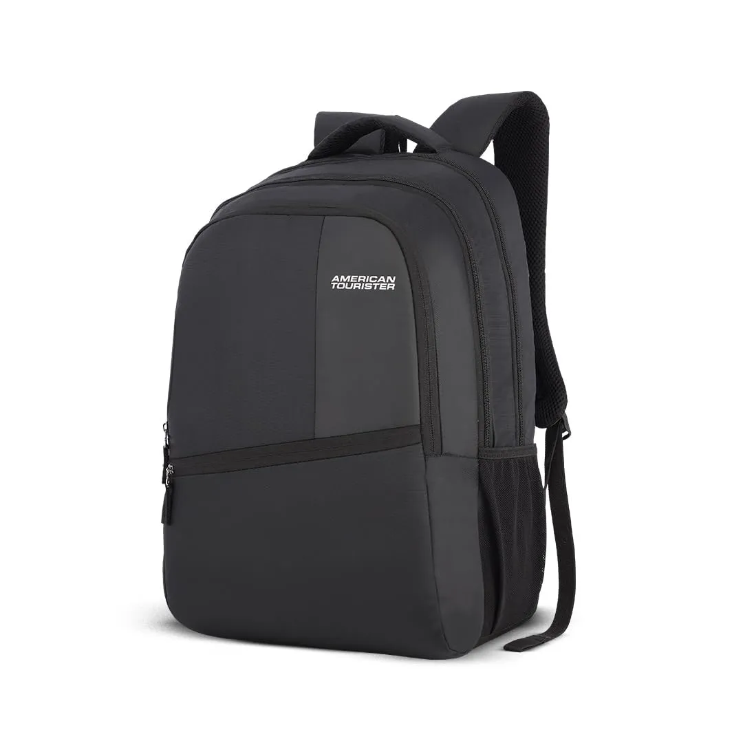 College student wearing a backpack on a campus walkway