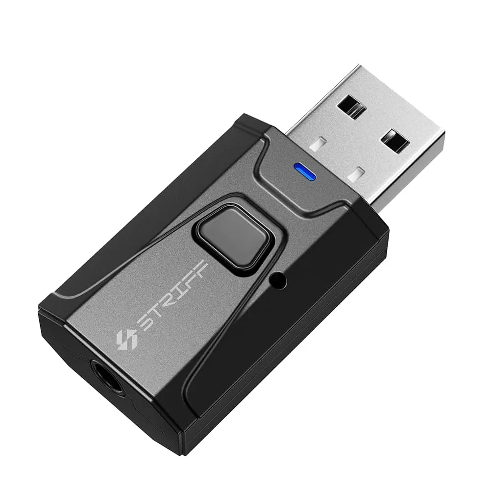 A sleek Bluetooth car adapter plugged into a car dashboard aux port.