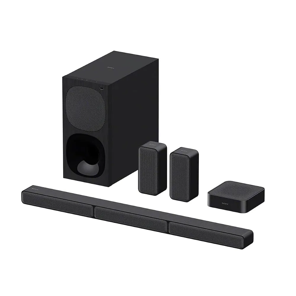 A modern living room featuring a sleek Bluetooth soundbar and wireless subwoofer placed under a flat screen TV.