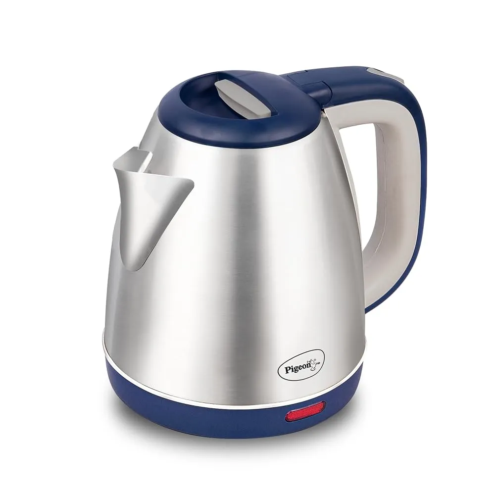 A stainless steel electric kettle boiling water on a kitchen counter