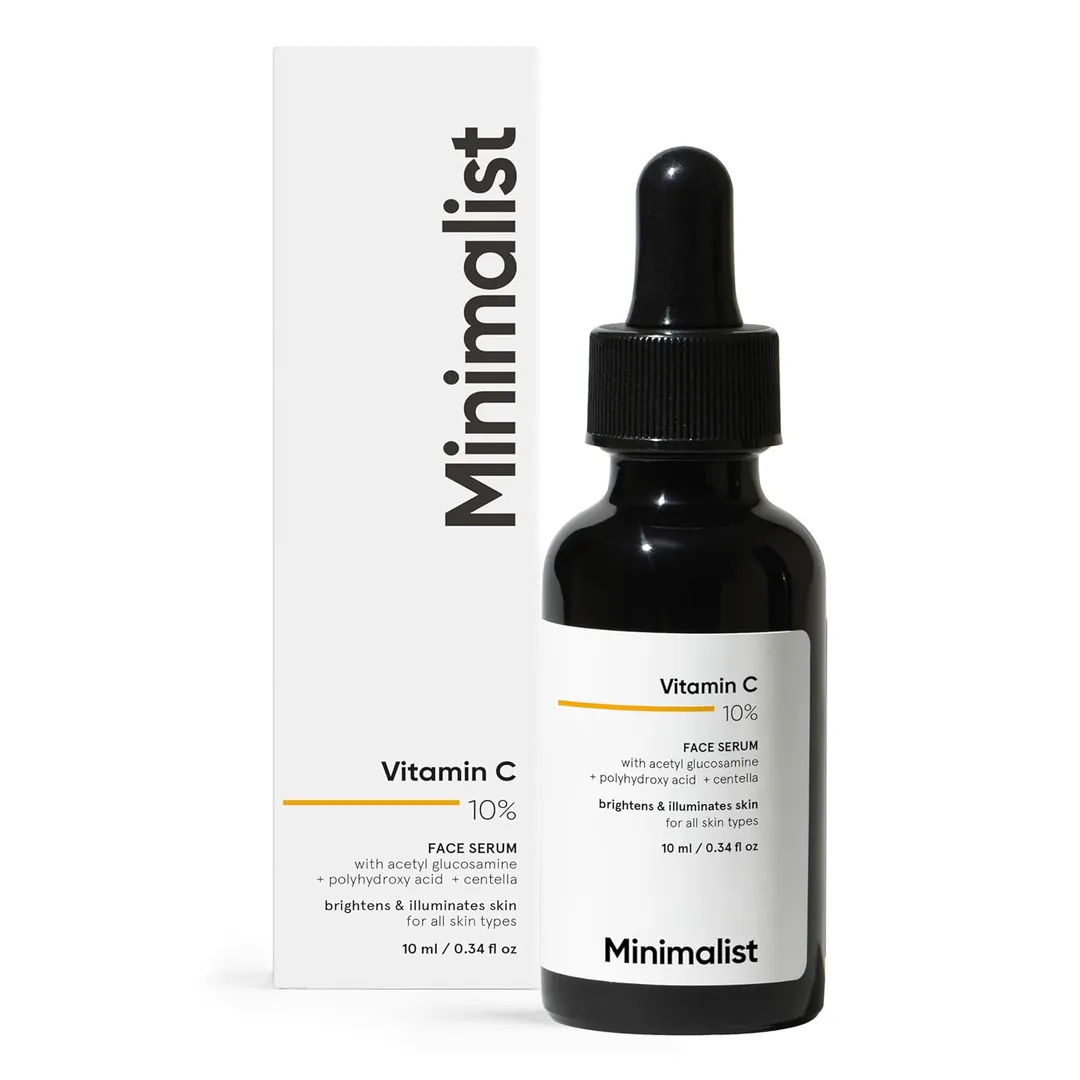 Face serum dropper bottle beside skincare items