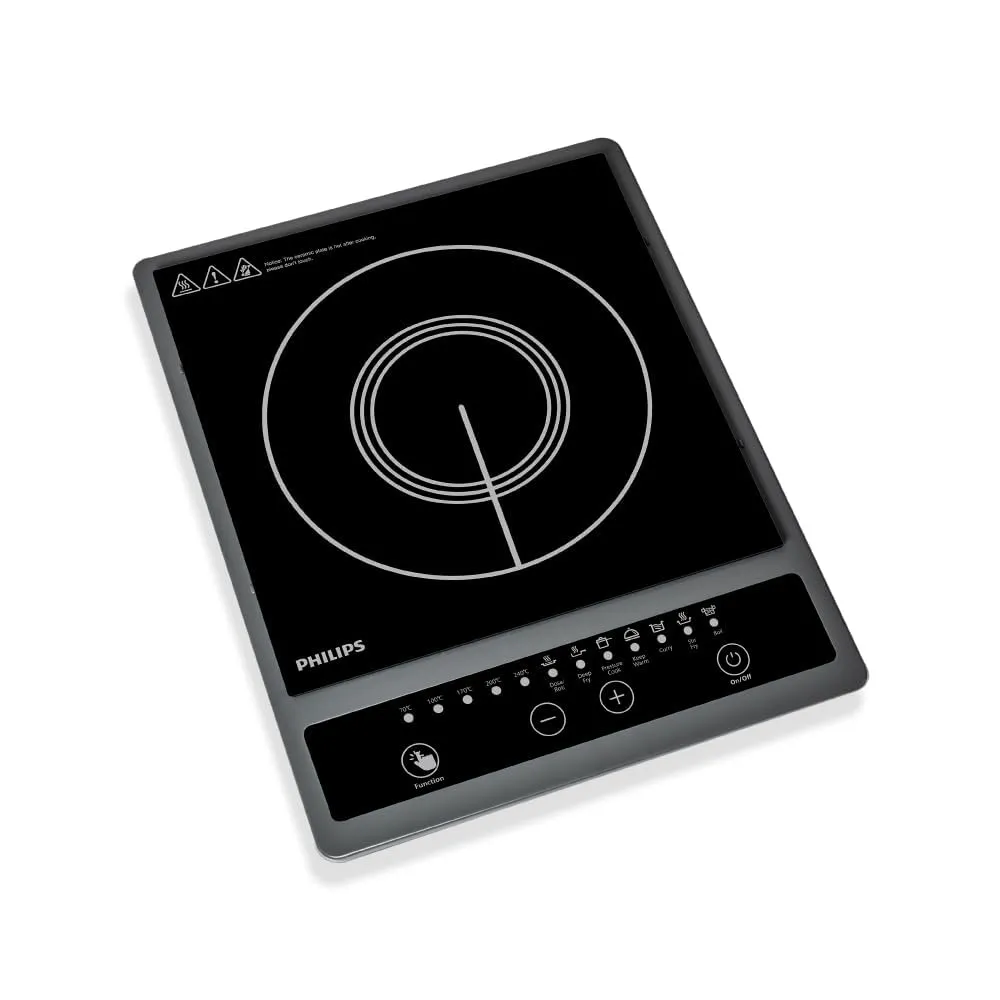 A clean, modern kitchen counter featuring a sleek Philips HD4928/01 induction cooktop with a stainless steel pan.