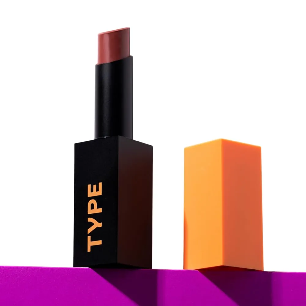 Collection of popular matte lipstick tubes and liquid lipsticks arranged on a neutral surface