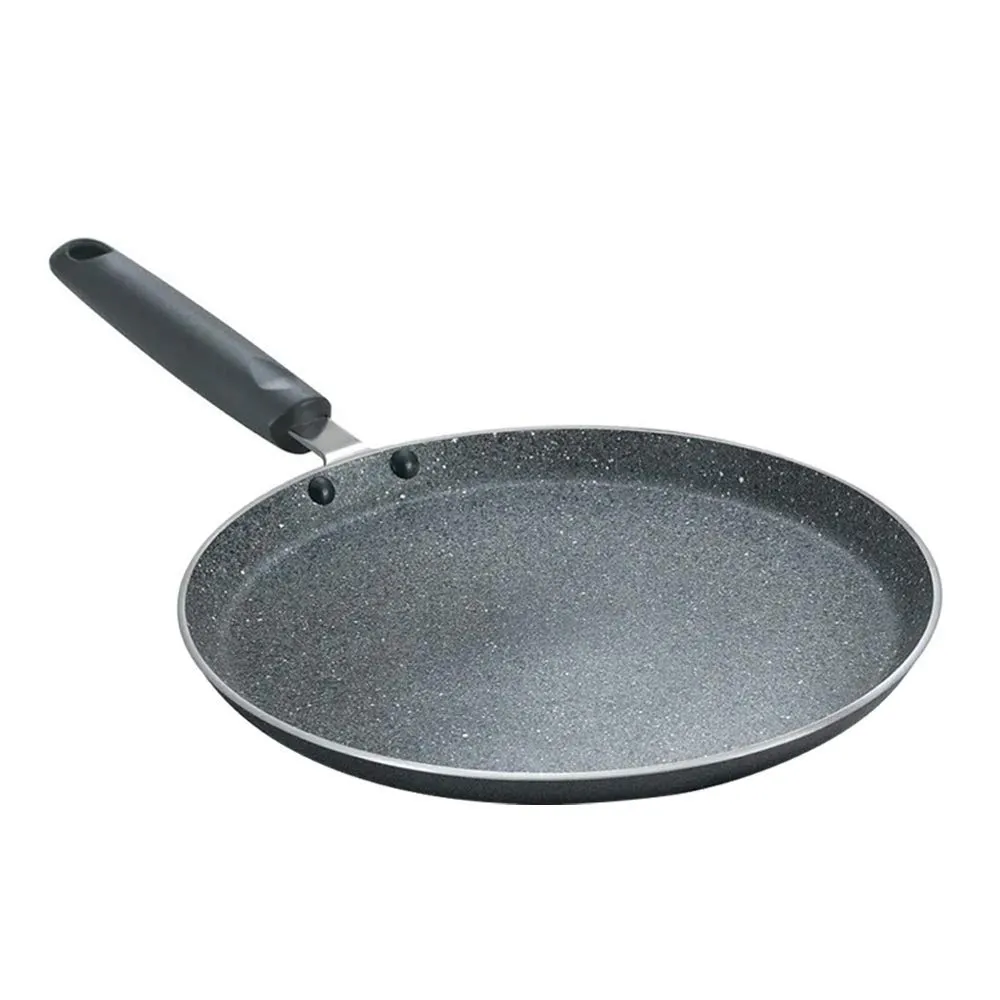 Non-stick frying pan on a gas stove in an Indian kitchen