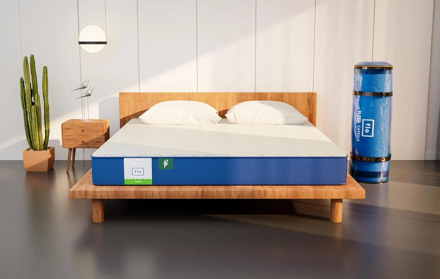 A comfortable, firm orthopedic mattress on a modern bed frame in a bright, clean bedroom.