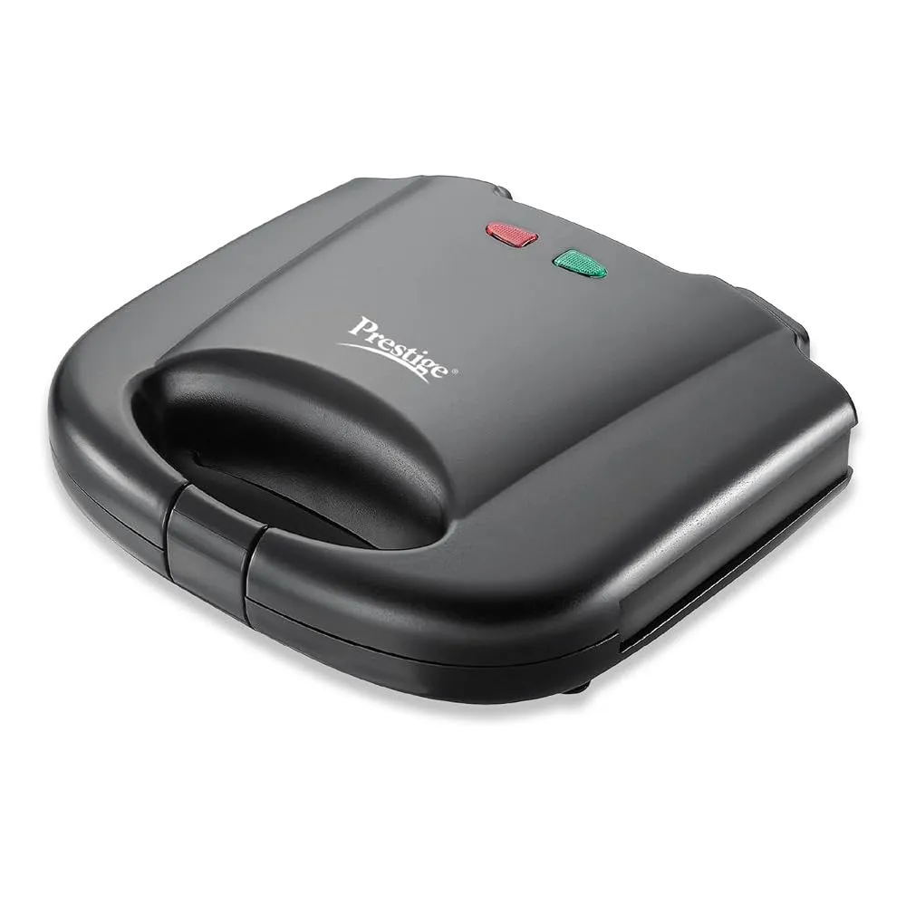 A grill sandwich maker toasting a sandwich on a modern Indian kitchen counter.