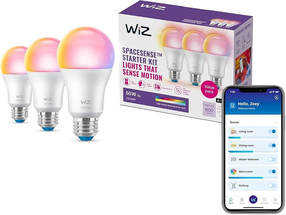 A collection of smart LED bulbs glowing with different colors on a wooden table.