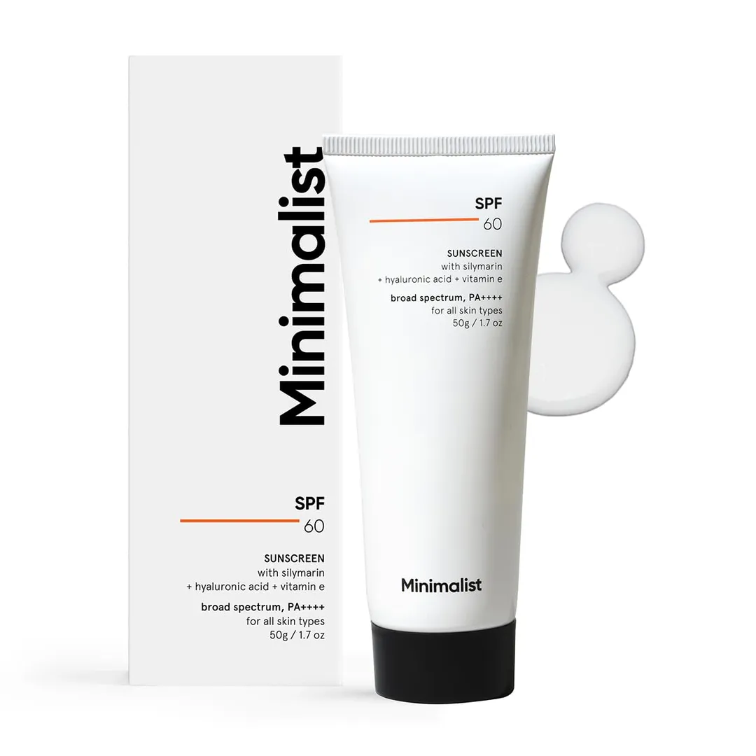 Sunscreen tube with a dab of cream beside it