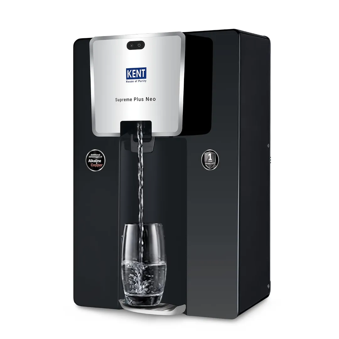 A modern wall-mounted water purifier installed in a clean, contemporary Indian kitchen.