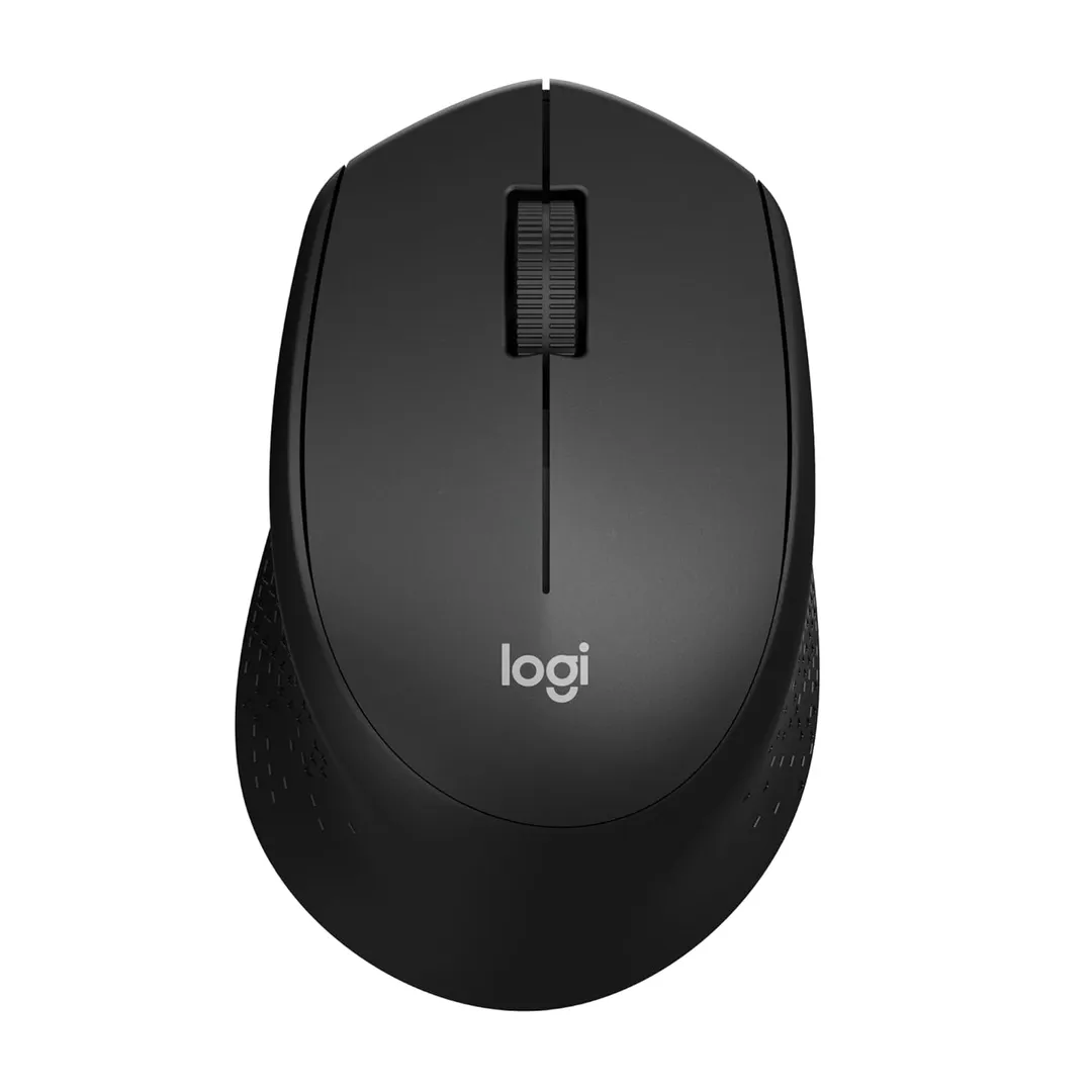 Wireless mouse on a desk beside a laptop